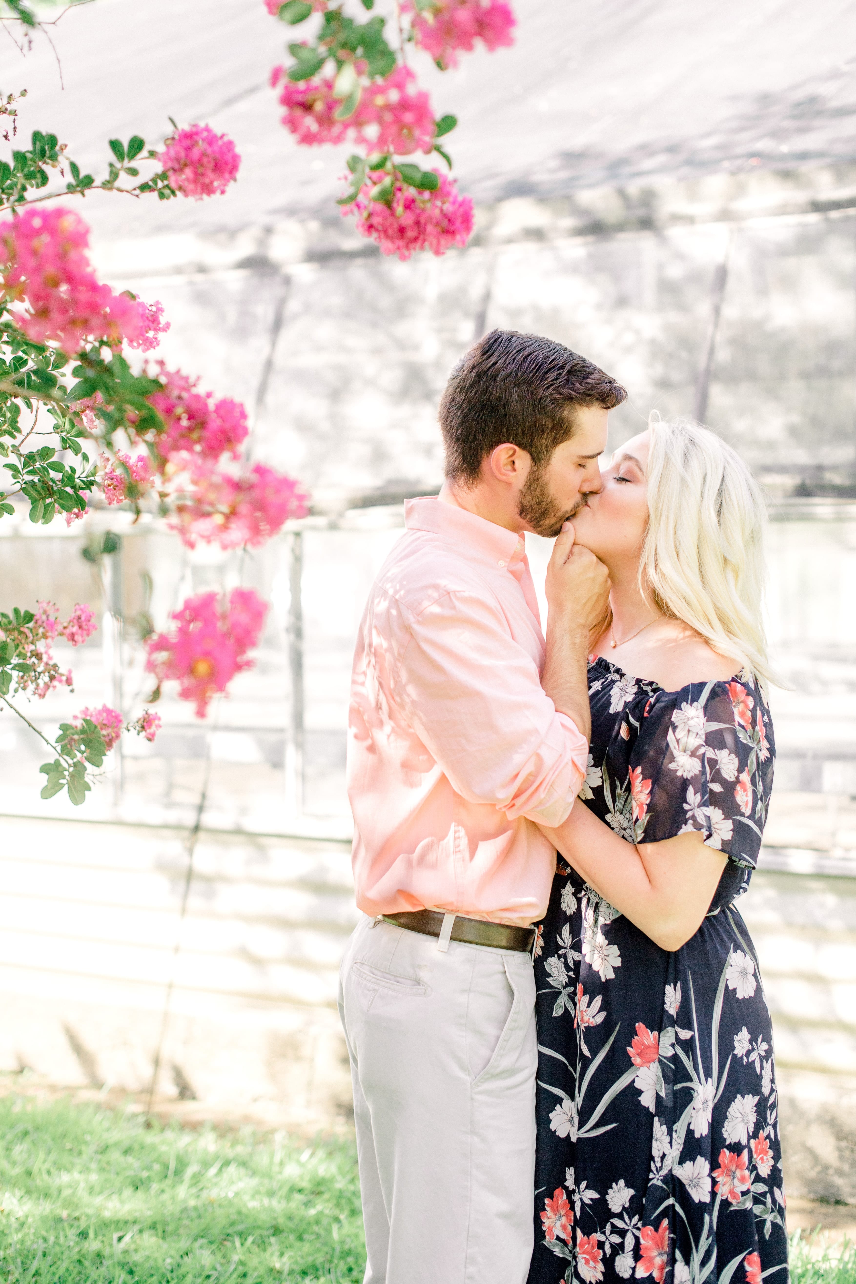 couple kissing at engagement session at LSU Botanical Gardens